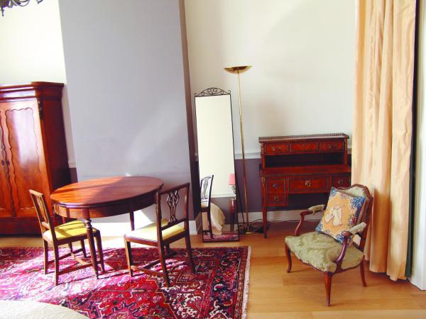 Louise Chatelain suites : photo 4 de la chambre chambre familiale - vue sur jardin