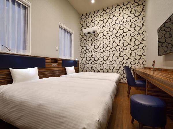 The BREAKFAST HOTEL Fukuoka Nakasu : photo 1 de la chambre chambre royale lits jumeaux - non-fumeurs