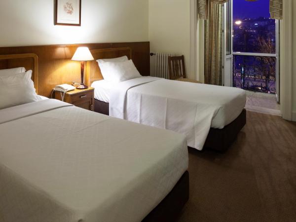 Hotel Astoria : photo 4 de la chambre chambre double ou lits jumeaux avec lit d'appoint