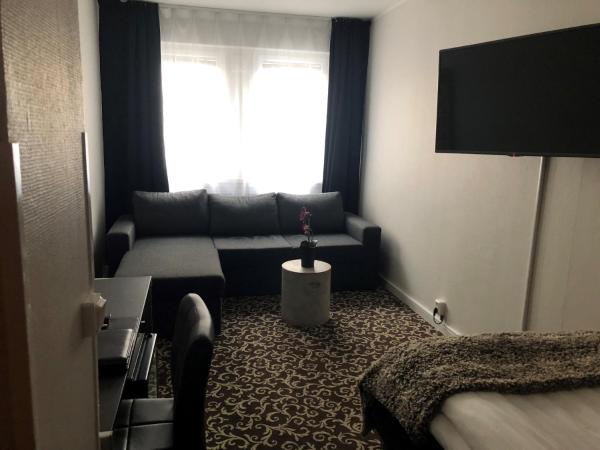 Sure Hotel by Best Western Algen : photo 6 de la chambre chambre simple avec canapé-lit