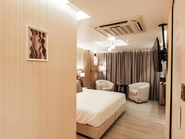 Amina Residency : photo 7 de la chambre chambre lit king-size de luxe supérieure avec balcon