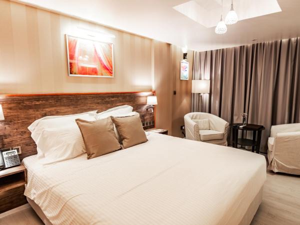 Amina Residency : photo 2 de la chambre chambre lit king-size de luxe supérieure avec balcon