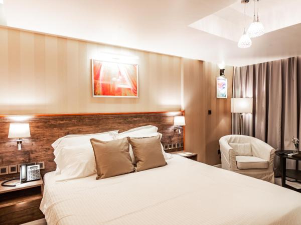 Amina Residency : photo 6 de la chambre chambre lit king-size de luxe supérieure avec balcon