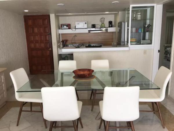 Beachfront Getaway Condo : photo 9 de la chambre appartement - vue sur jardin