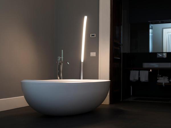 Foro Carolino S&B : photo 3 de la chambre suite lit king-size avec baignoire