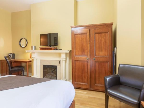 Unilofts Grande-Allée : photo 3 de la chambre chambre standard avec lit queen-size