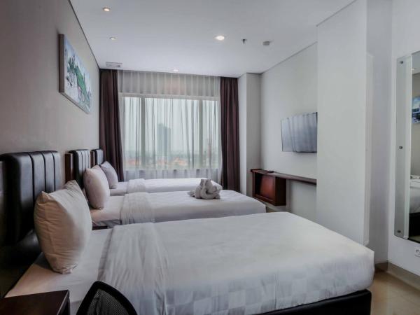 PrimeBiz Hotel Surabaya : photo 1 de la chambre chambre triple supérieure