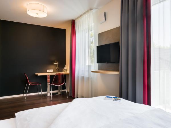 Signature East Hotel Apartment : photo 1 de la chambre chambre double avec lit queen-size