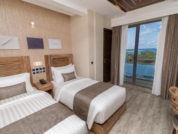 Samann Grand : photo 6 de la chambre hébergement double ou lits jumeaux deluxe avec balcon - vue sur océan (navette aéroport aller-retour gratuite)