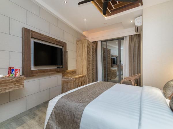 Samann Grand : photo 9 de la chambre hébergement double super deluxe avec balcon - vue sur océan (navette aéroport aller-retour gratuite)