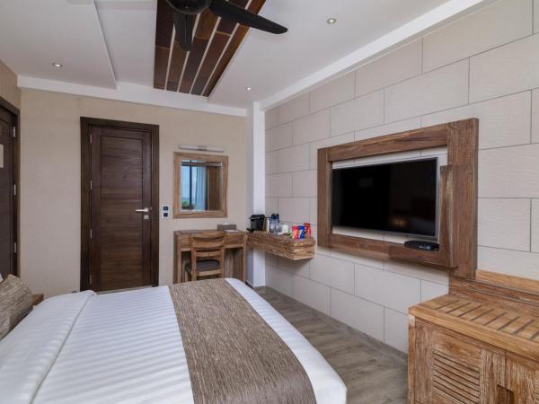 Samann Grand : photo 7 de la chambre hébergement double super deluxe avec balcon - vue sur océan (navette aéroport aller-retour gratuite)