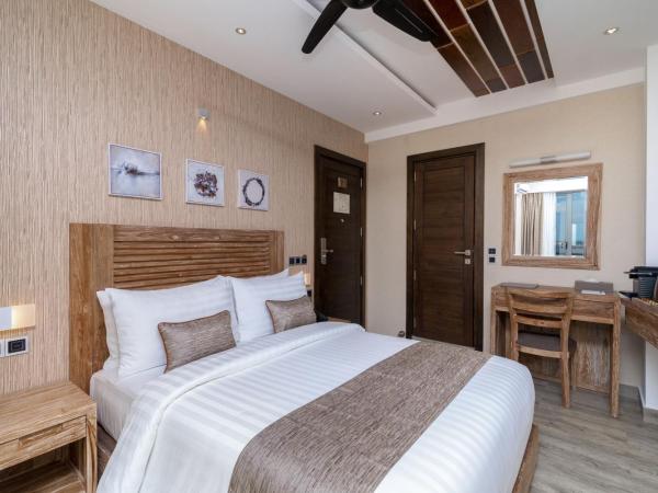 Samann Grand : photo 6 de la chambre hébergement double super deluxe avec balcon - vue sur océan (navette aéroport aller-retour gratuite)