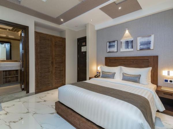 Samann Grand : photo 7 de la chambre suite exécutive avec balcon - navette aéroport aller-retour gratuite