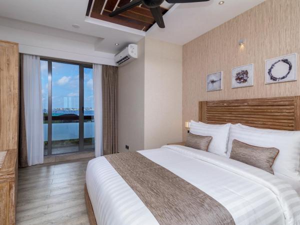 Samann Grand : photo 5 de la chambre hébergement double super deluxe avec balcon - vue sur océan (navette aéroport aller-retour gratuite)