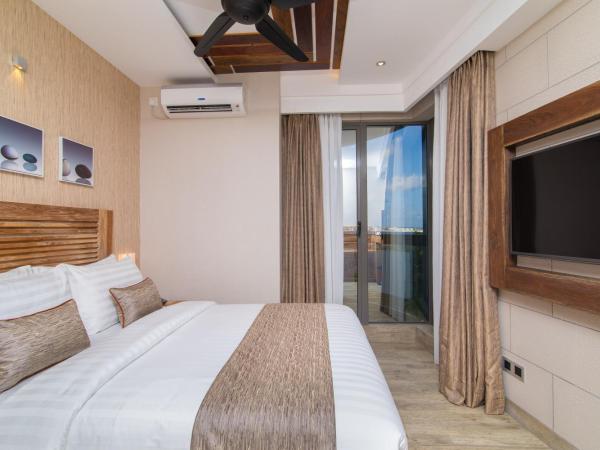 Samann Grand : photo 7 de la chambre hébergement double deluxe avec balcon - vue sur océan (navette aéroport aller-retour gratuite)