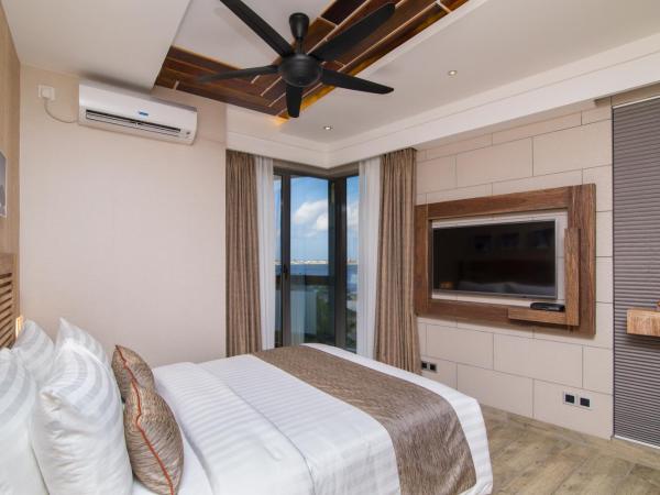 Samann Grand : photo 6 de la chambre hébergement double deluxe avec balcon - vue sur océan (navette aéroport aller-retour gratuite)