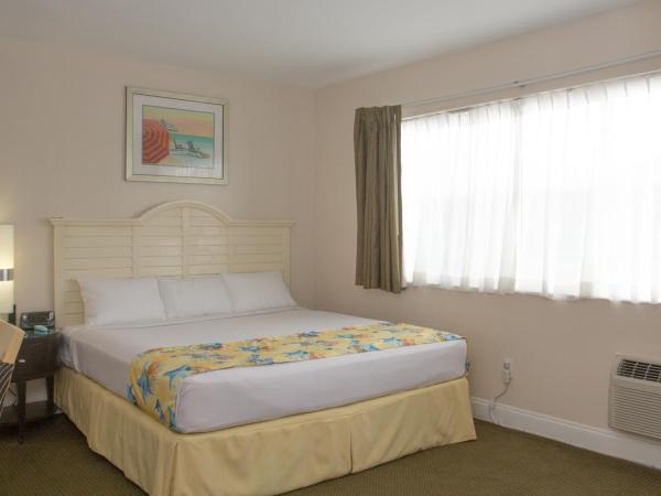 Beach Place Hotel : photo 1 de la chambre hébergement lit king-size supérieur avec kitchenette - parking gratuit