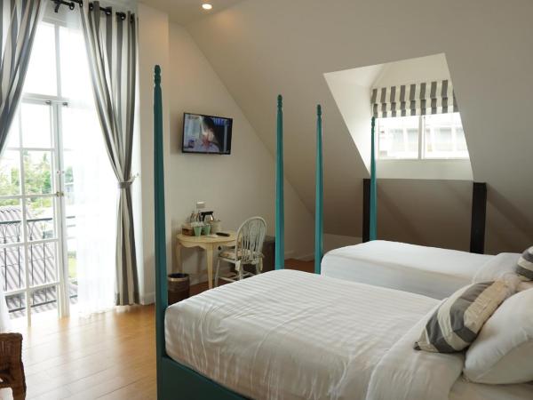 Nai Suan Bed and Breakfast : photo 2 de la chambre suite familiale avec balcon