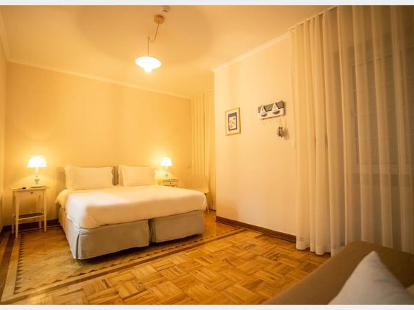 Senhor Gigi : photo 5 de la chambre chambre double ou lits jumeaux deluxe – vue sur jardin