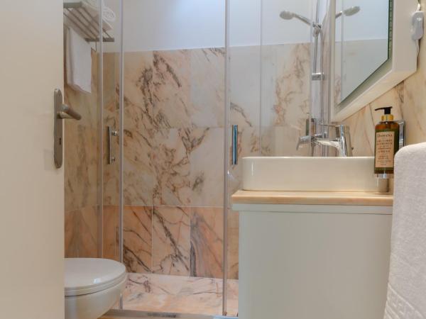 Ver Belém Suites : photo 10 de la chambre chambre lit queen-size - vue sur jardin