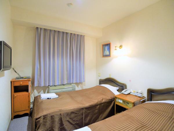 Famy Inn Makuhari : photo 1 de la chambre chambre lits jumeaux - non-fumeurs