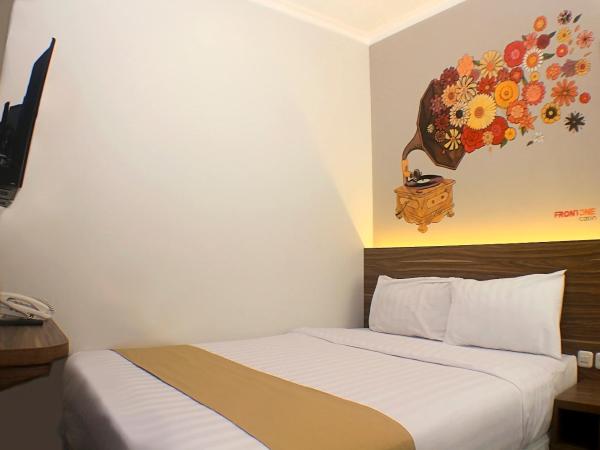 Front One Cabin Malioboro Jogja : photo 1 de la chambre petite chambre double