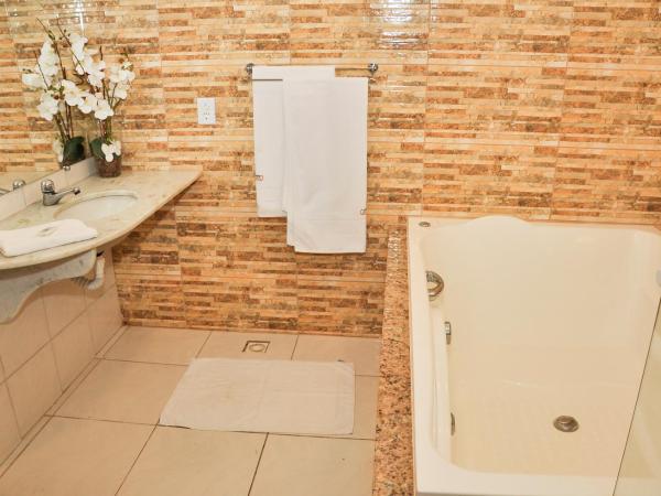 Pousada dos Guardiões : photo 1 de la chambre suite avec jacuzzi