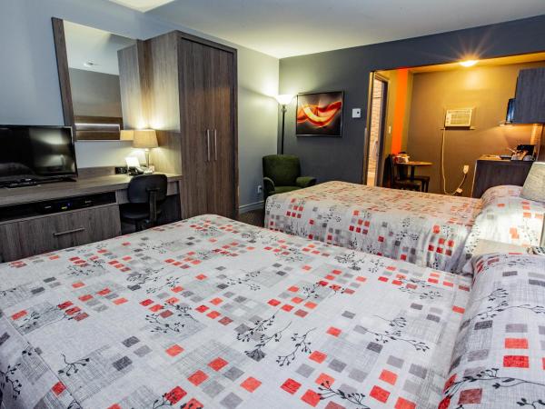 Hotel et Motel Le Chateauguay : photo 7 de la chambre chambre double avec 2 lits doubles et kitchenette