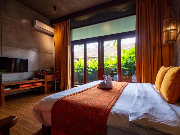 Ipoh Bali Hotel : photo 4 de la chambre chambre double supérieure avec baignoire - vue sur jardin