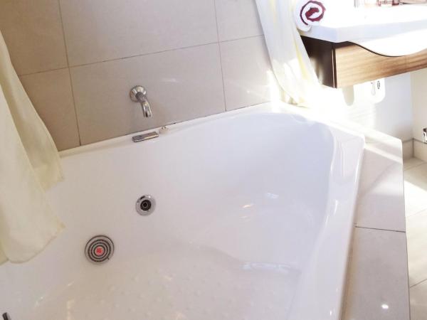 Dunedin Palms Motel : photo 5 de la chambre studio avec baignoire spa