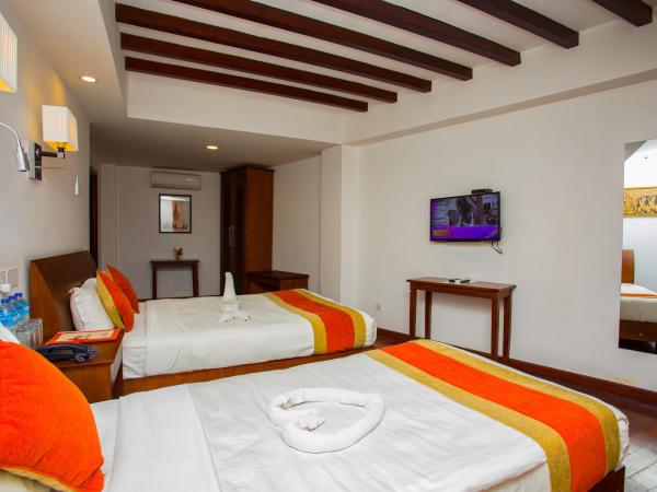 Apsara Boutique Hotel : photo 5 de la chambre chambre triple deluxe avec vue sur jardin