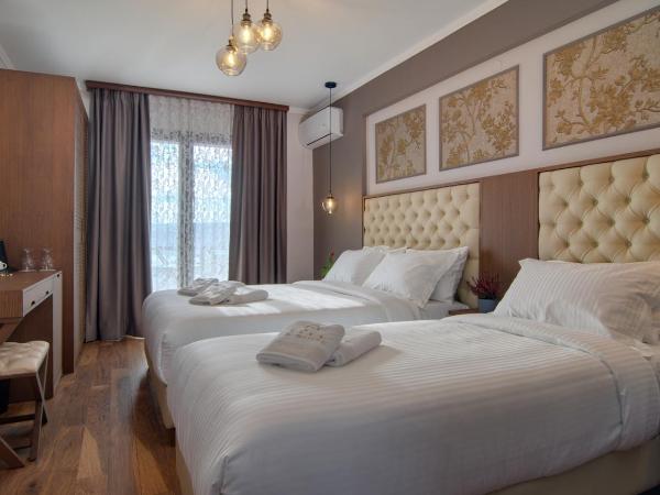 La Suite Boutique Hotel & Spa : photo 1 de la chambre chambre triple de luxe avec vue sur lac