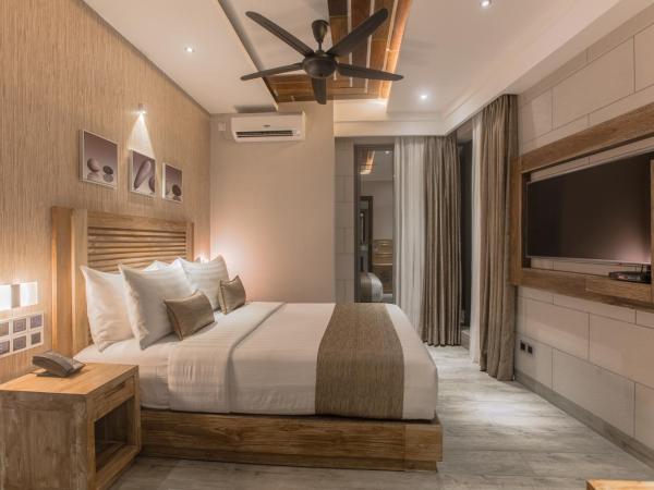 Samann Grand : photo 2 de la chambre hébergement double deluxe avec balcon - vue sur océan (navette aéroport aller-retour gratuite)