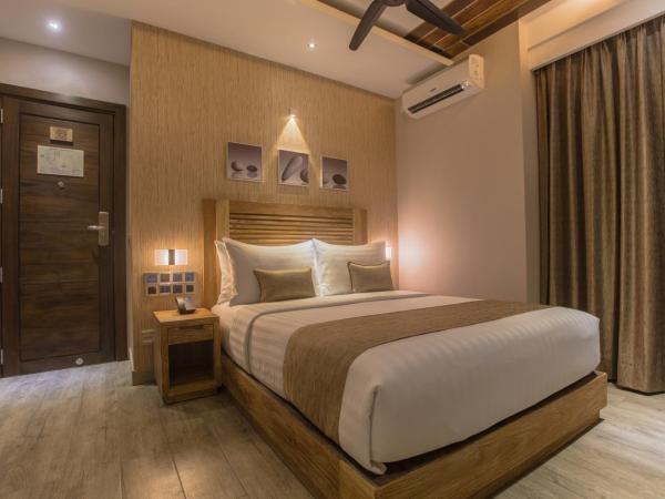 Samann Grand : photo 5 de la chambre hébergement double deluxe avec balcon - vue sur océan (navette aéroport aller-retour gratuite)