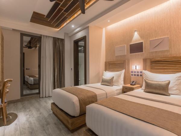 Samann Grand : photo 1 de la chambre hébergement double ou lits jumeaux deluxe avec balcon - vue sur océan (navette aéroport aller-retour gratuite)