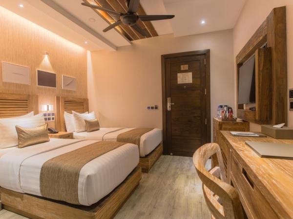 Samann Grand : photo 3 de la chambre hébergement double ou lits jumeaux deluxe avec balcon - vue sur océan (navette aéroport aller-retour gratuite)