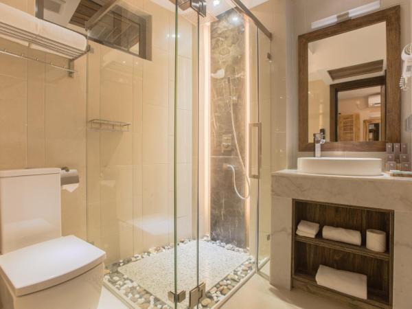 Samann Grand : photo 10 de la chambre hébergement double ou lits jumeaux deluxe avec balcon - vue sur océan (navette aéroport aller-retour gratuite)