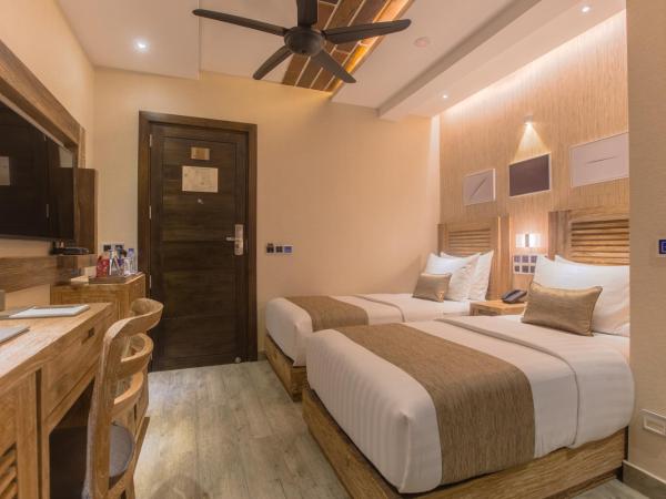 Samann Grand : photo 9 de la chambre hébergement double ou lits jumeaux deluxe avec balcon - vue sur océan (navette aéroport aller-retour gratuite)