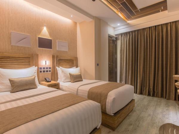 Samann Grand : photo 2 de la chambre hébergement double ou lits jumeaux deluxe avec balcon - vue sur océan (navette aéroport aller-retour gratuite)