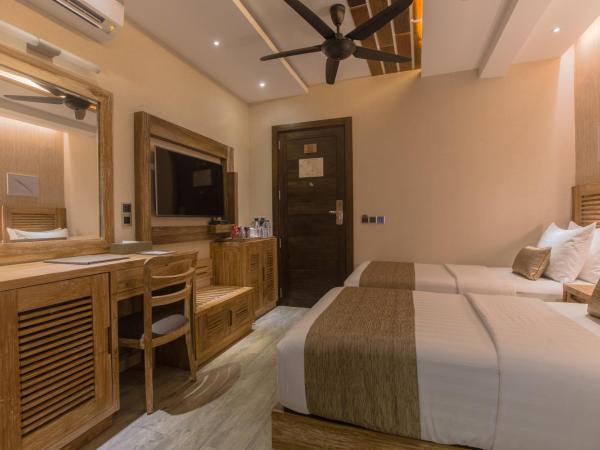 Samann Grand : photo 5 de la chambre hébergement double ou lits jumeaux deluxe avec balcon - vue sur océan (navette aéroport aller-retour gratuite)