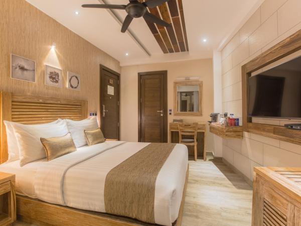 Samann Grand : photo 1 de la chambre hébergement double super deluxe avec balcon - vue sur océan (navette aéroport aller-retour gratuite)