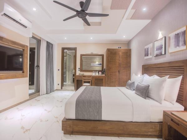 Samann Grand : photo 1 de la chambre suite samann avec balcon (navette aéroport aller-retour gratuite)