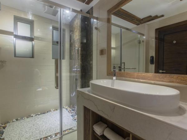 Samann Grand : photo 10 de la chambre hébergement double deluxe avec balcon - vue sur océan (navette aéroport aller-retour gratuite)