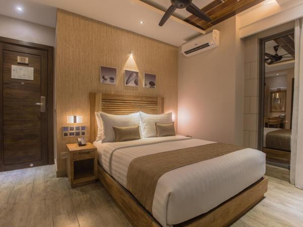 Samann Grand : photo 1 de la chambre hébergement double deluxe avec balcon - vue sur océan (navette aéroport aller-retour gratuite)