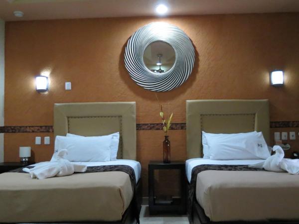 Villas y Suites Paraiso del Sur : photo 1 de la chambre chambre avec 2 grands lits queen-size 