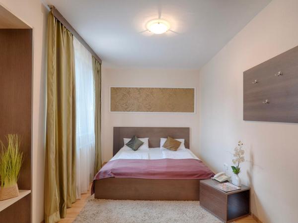 Triple M Hotel : photo 2 de la chambre petite chambre double ou lits jumeaux