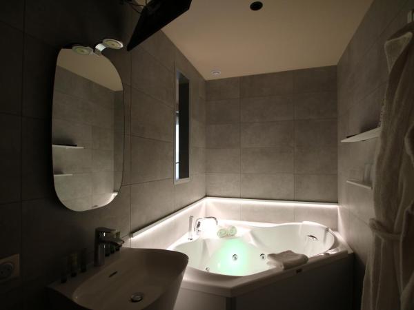 Les Loges Du Parc : photo 6 de la chambre chambre double deluxe avec baignoire spa - loup