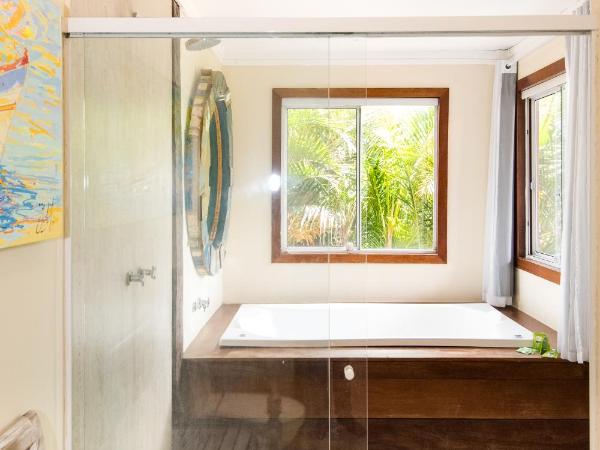 Pousada La Dolce Vita : photo 1 de la chambre suite de luxe avec baignoire spa
