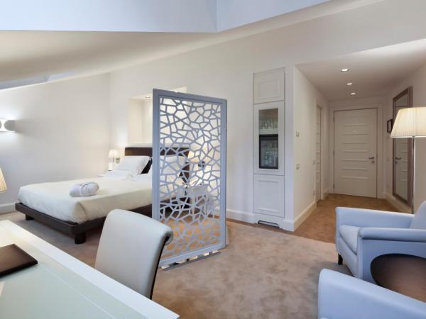Maison Milano | UNA Esperienze : photo 1 de la chambre suite junior double avec lit d'appoint