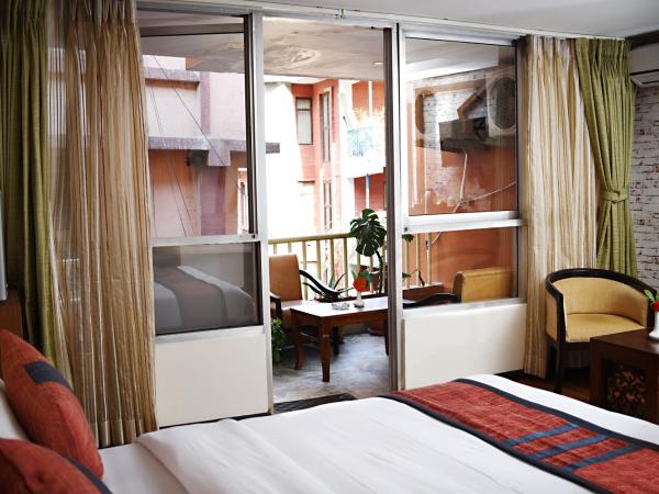 Hotel Jampa : photo 3 de la chambre suite lit king-size avec balcon - navette aéroport aller ou retour gratuite